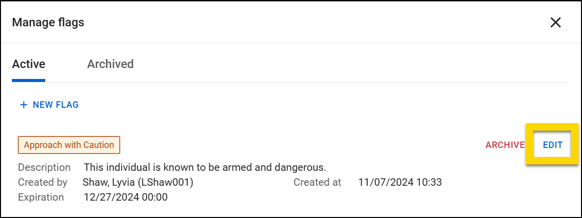 The image displays a Manage flags window. There is one flag entry, labeled Approach with Caution. It includes a description warning that the individual is armed and dangerous, with an EDIT option highlighted in yellow.