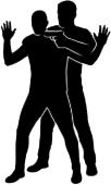 Silhouette of one person holding another at gunpoint from behind, with the hostage’s hands raised.